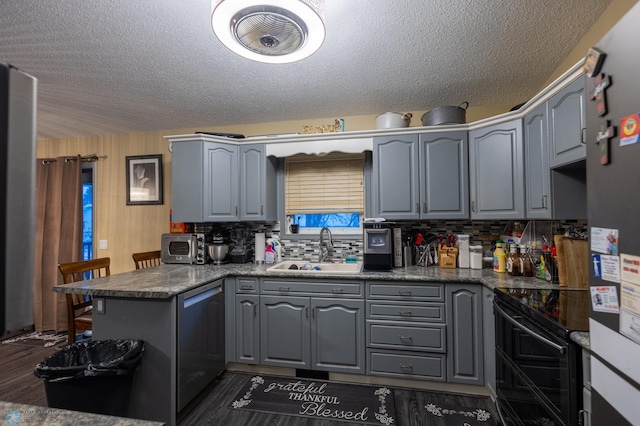 1215 18th St N, Moorhead, MN 56560 - kitchen with a sink, gray cabinetry, dishwasher, a peninsula, and electric range