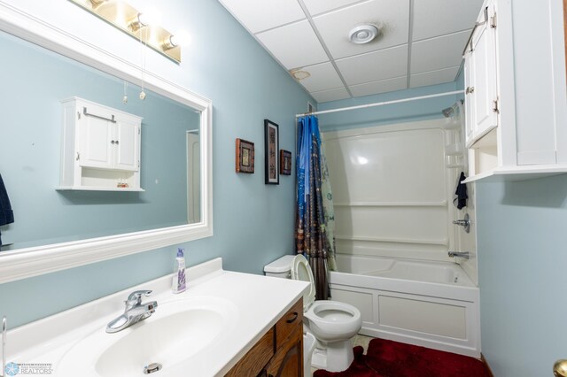 1215 18th St N, Moorhead, MN 56560 - full bathroom featuring vanity, toilet, shower / bath combination with curtain, and a paneled ceiling