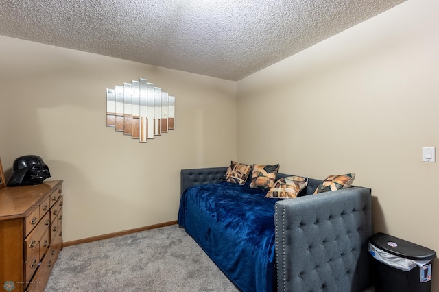 1215 18th St N, Moorhead, MN 56560 - bedroom featuring light colored carpet, a textured ceiling, and baseboards