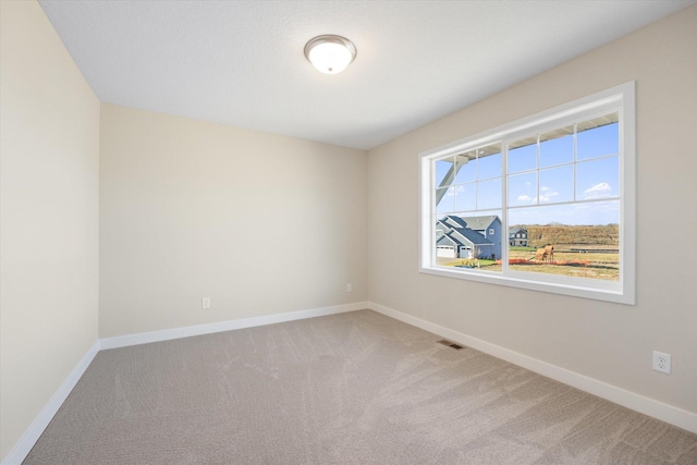 view of carpeted spare room