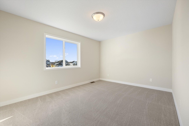 unfurnished room with carpet