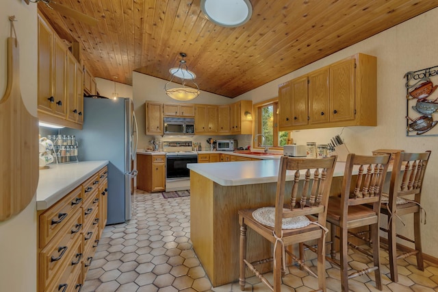 kitchen featuring a kitchen bar, kitchen peninsula, white electric range oven, vaulted ceiling, and pendant lighting