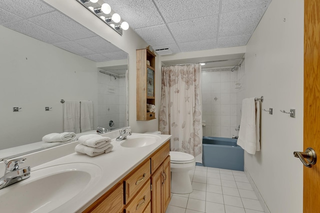 full bathroom with tile patterned flooring, vanity, shower / tub combo with curtain, and toilet