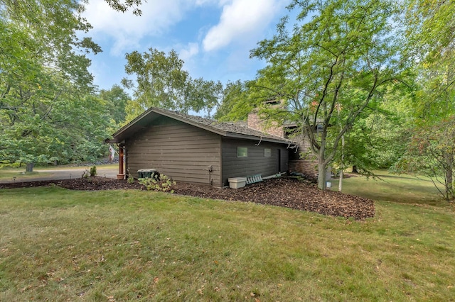 view of home's exterior featuring a lawn