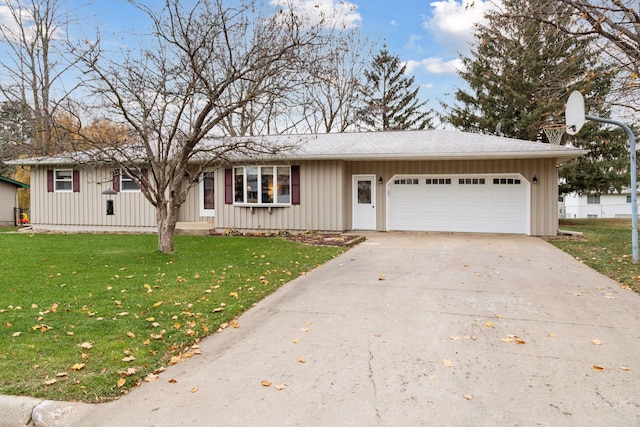 ranch-style house featuring a garage and a front lawn