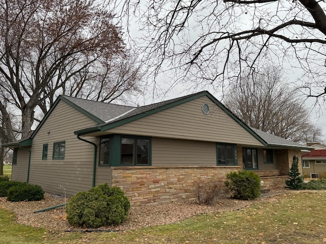 view of home's exterior featuring a lawn