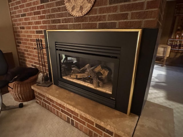 details featuring a brick fireplace