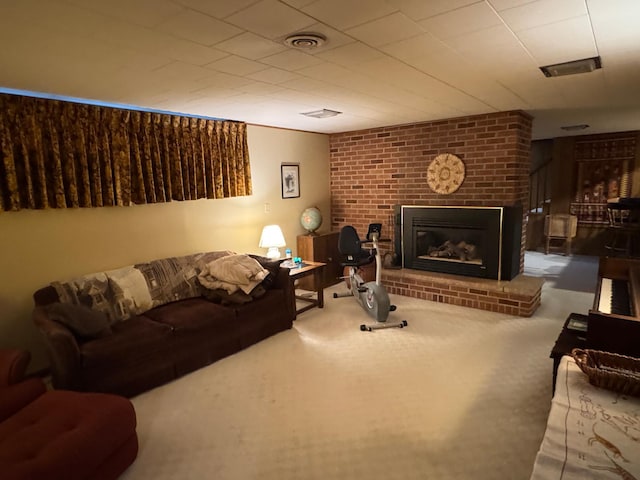 living room featuring carpet floors and a brick fireplace