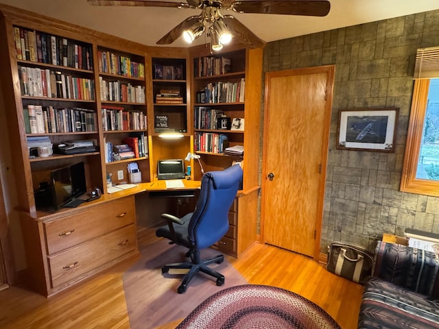 office space featuring ceiling fan and light wood-type flooring