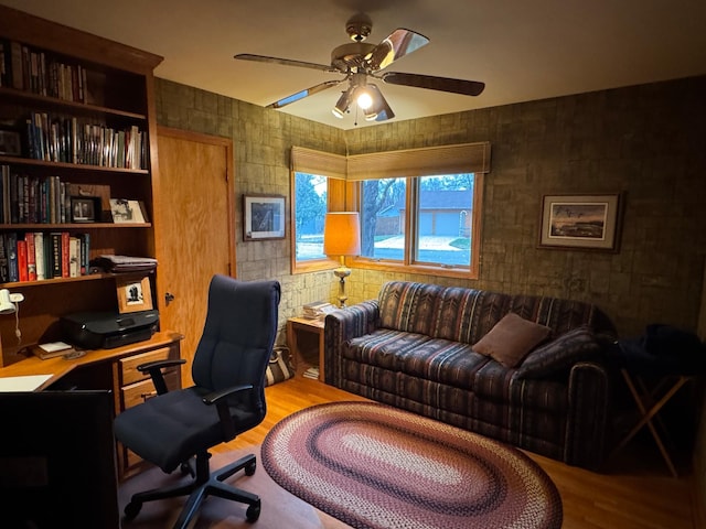 office with ceiling fan and hardwood / wood-style floors