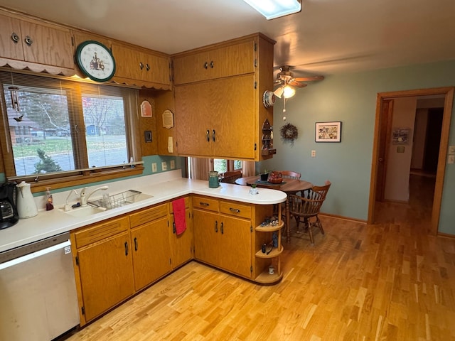 kitchen featuring ceiling fan, sink, dishwasher, light hardwood / wood-style flooring, and kitchen peninsula