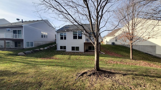 rear view of house with a yard