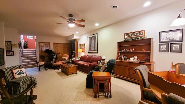 living room featuring recessed lighting, visible vents, light colored carpet, and ceiling fan