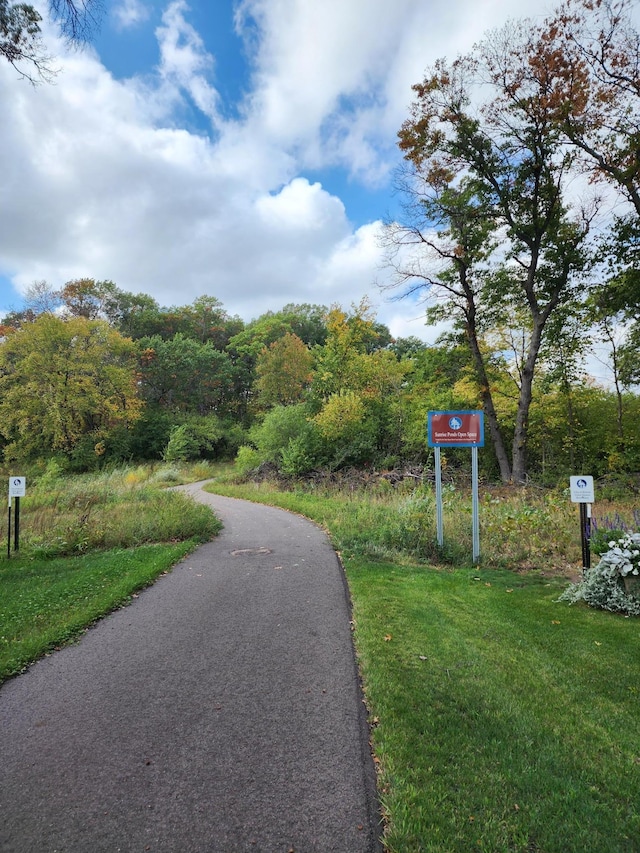 view of home's community with a lawn