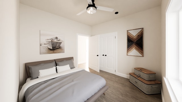 bedroom featuring hardwood / wood-style flooring, ceiling fan, and a closet