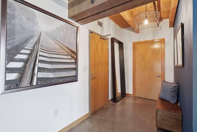 hall featuring beam ceiling and wood ceiling