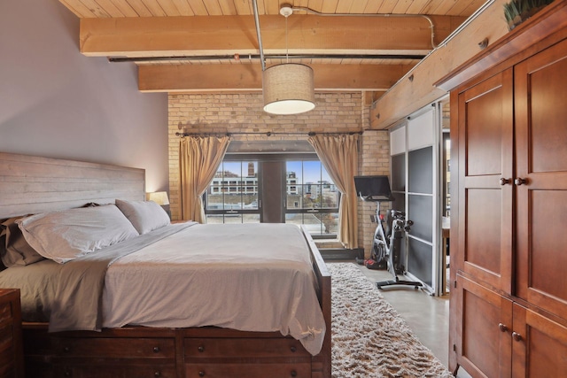 bedroom featuring beam ceiling, wood ceiling, and concrete flooring