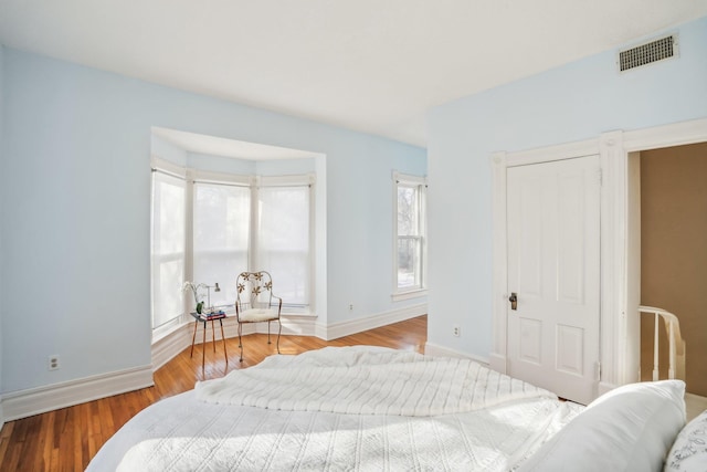 bedroom with light hardwood / wood-style floors