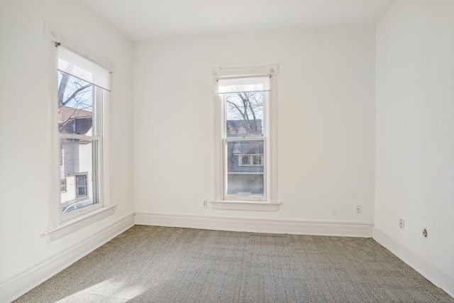 unfurnished room with carpet and a healthy amount of sunlight