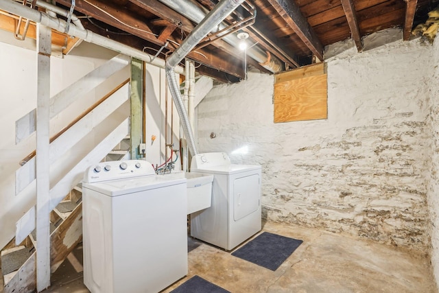 washroom featuring washer and clothes dryer