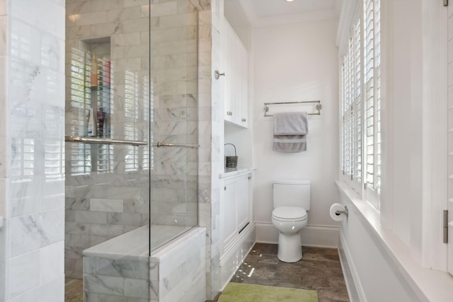 full bathroom with baseboards, toilet, crown molding, vanity, and a walk in shower