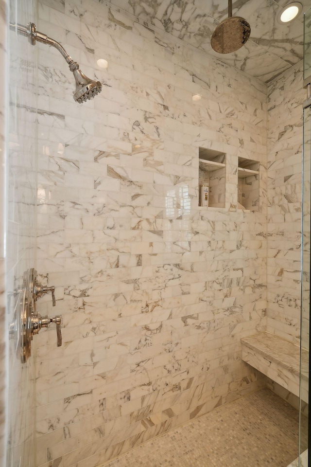 bathroom featuring a tile shower