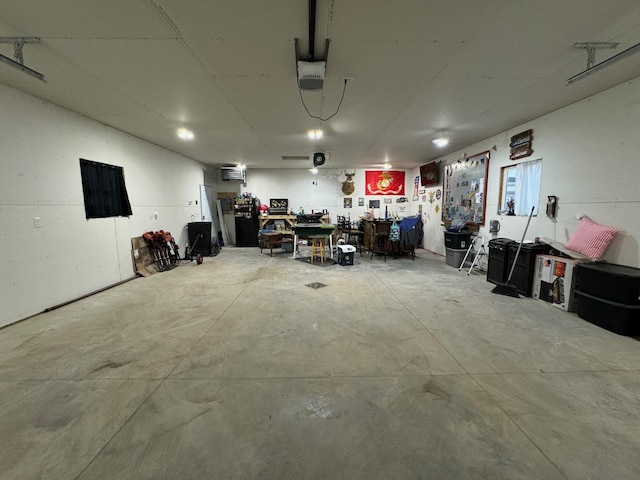 1630 3rd St N, Fargo, ND 58102 - garage with a garage door opener, a workshop area, and an AC wall unit