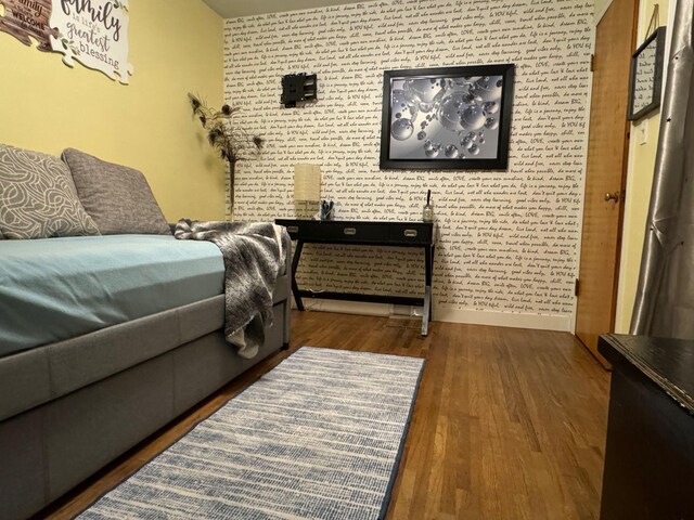 1630 3rd St N, Fargo, ND 58102 - bedroom with an accent wall and wood finished floors