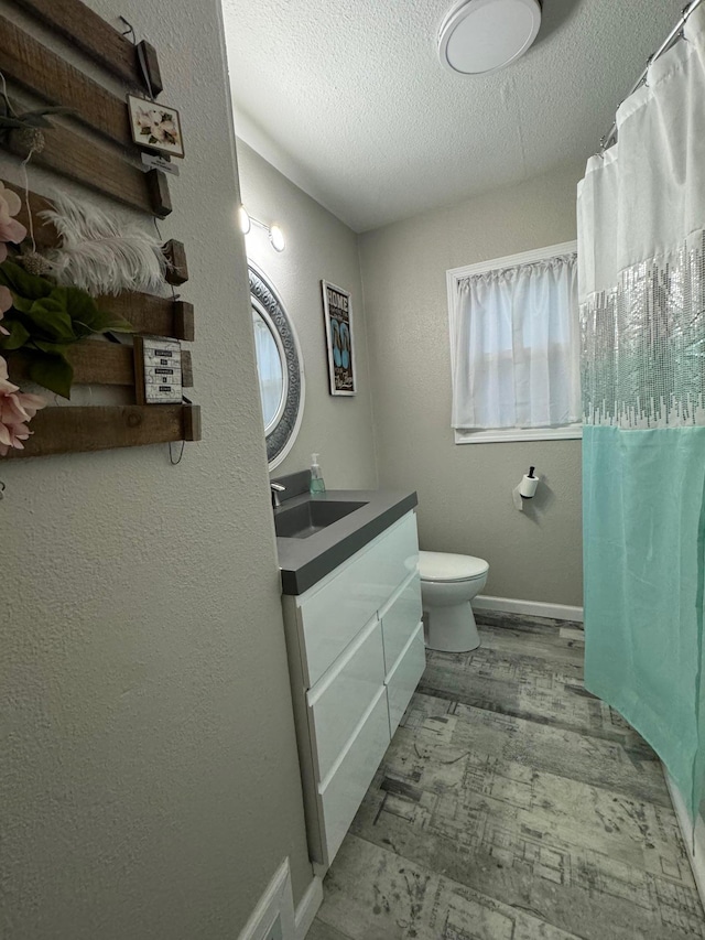 1630 3rd St N, Fargo, ND 58102 - bathroom with vanity, a textured ceiling, and a shower with shower curtain