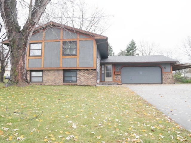 view of front of property featuring a carport, a garage, and a front lawn