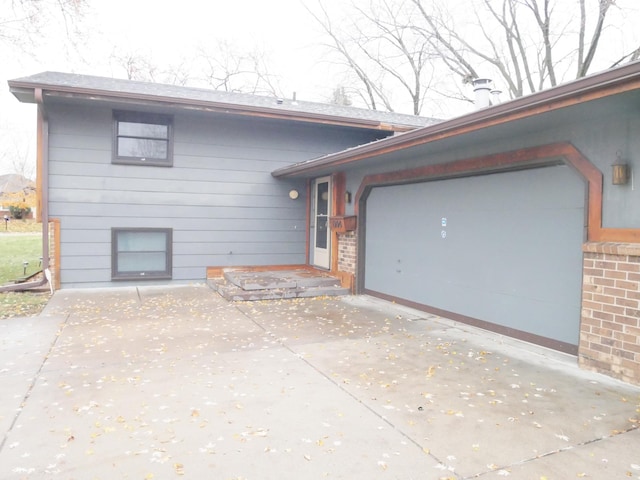 view of side of home featuring a garage