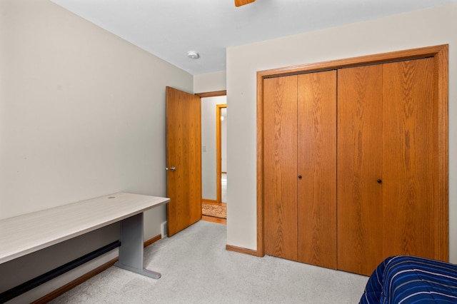 carpeted bedroom featuring a closet