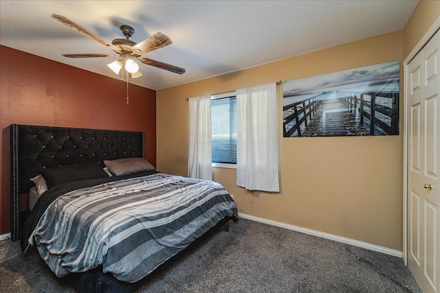 carpeted bedroom featuring ceiling fan and a closet