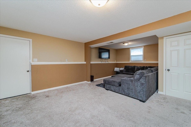 carpeted living room with a textured ceiling