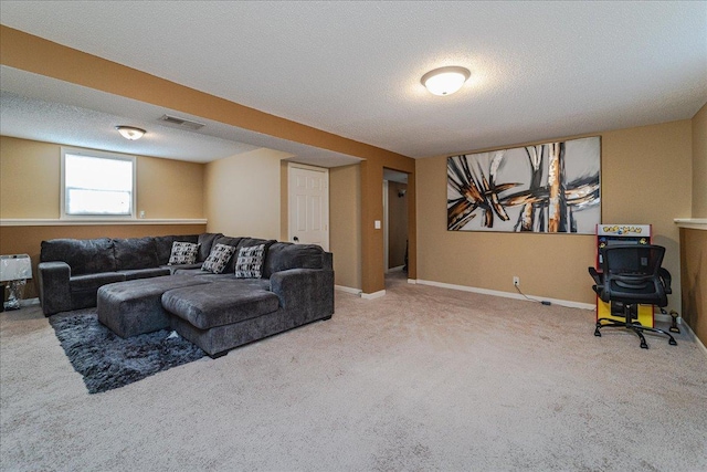 carpeted living room with a textured ceiling