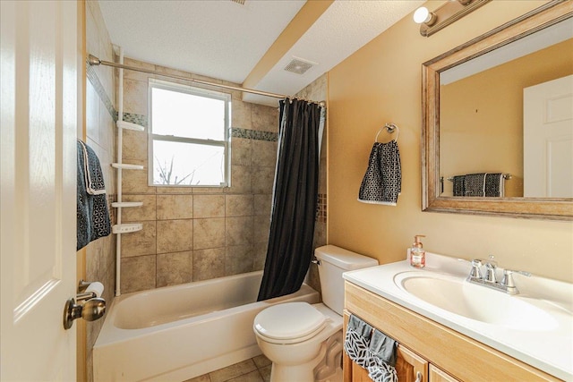 full bathroom featuring shower / bath combo, tile patterned flooring, a textured ceiling, toilet, and vanity