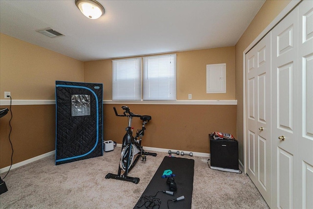 exercise room with light carpet