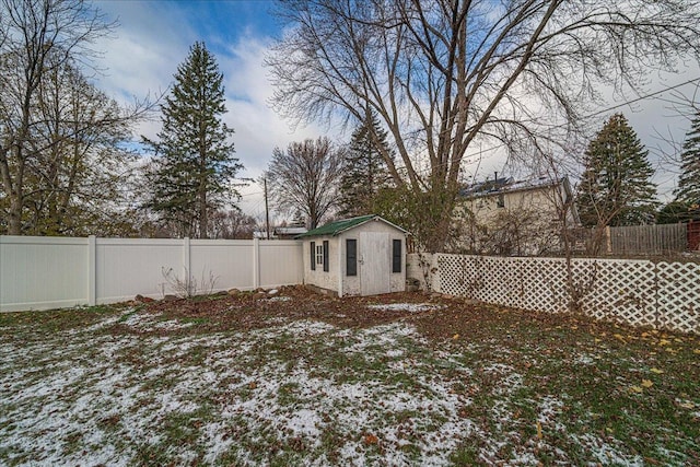 yard covered in snow featuring an outdoor structure