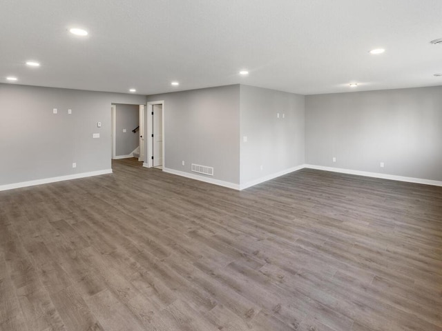 spare room featuring wood-type flooring