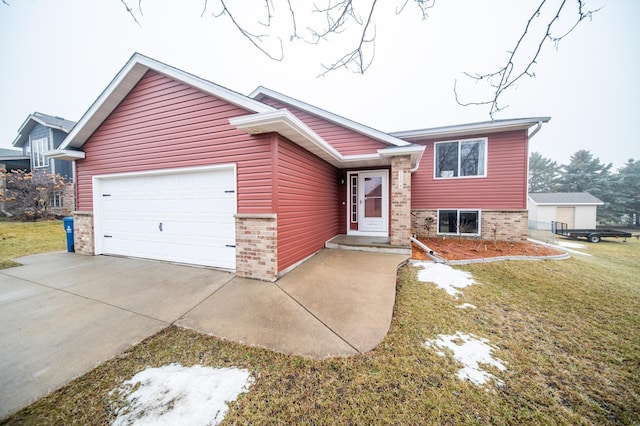 view of front of house featuring a front yard and a garage