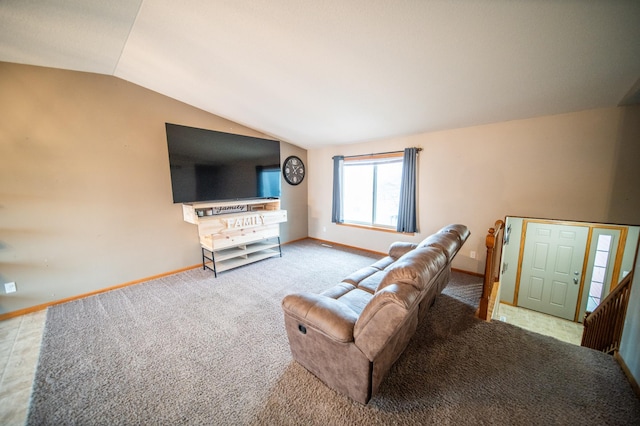 living room with light colored carpet and vaulted ceiling