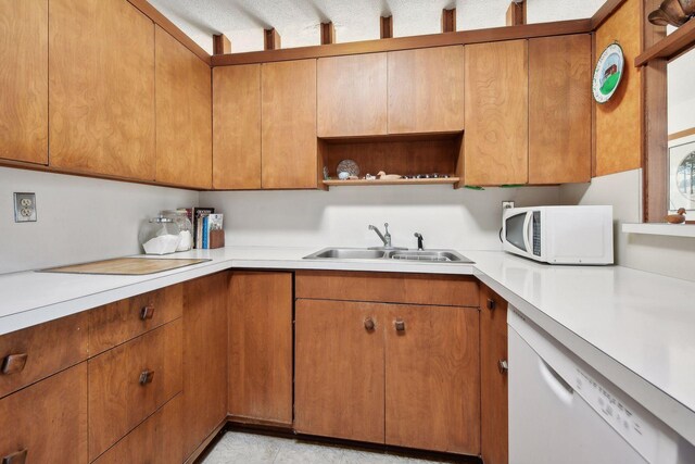 kitchen with white appliances and sink