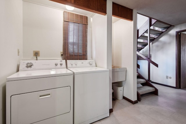 laundry area with washing machine and clothes dryer