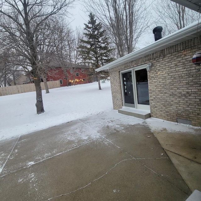 view of snow covered patio