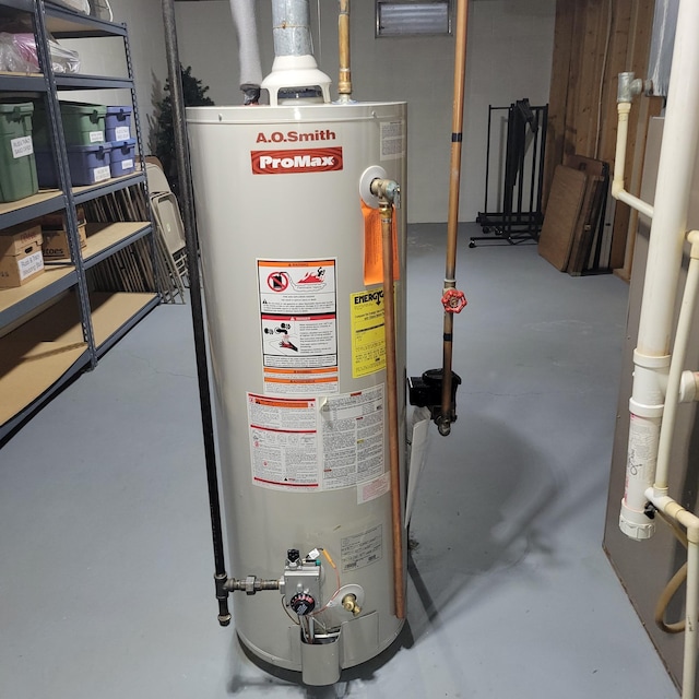 utility room featuring gas water heater