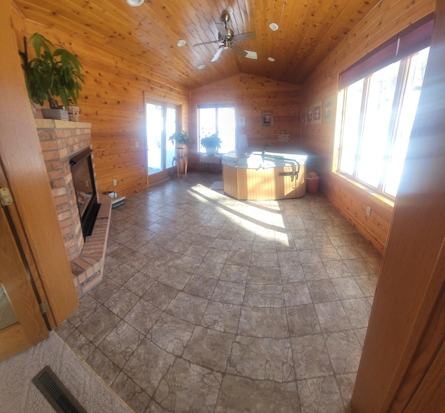 unfurnished office featuring wooden ceiling, a fireplace, and wooden walls