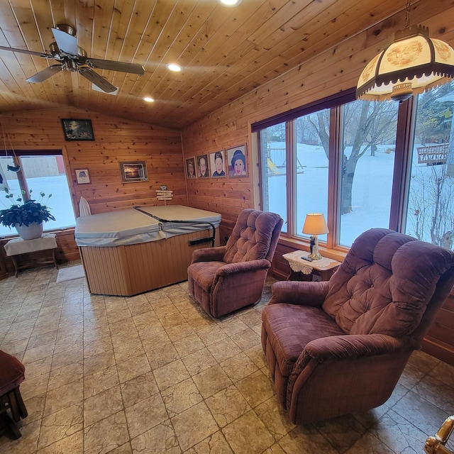 rec room with wooden walls, ceiling fan, wood ceiling, vaulted ceiling, and recessed lighting