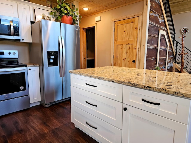 44811 County Highway 14, Perham, MN 56573 - kitchen featuring white cabinets, dark hardwood / wood-style floors, light stone countertops, wood ceiling, and stainless steel appliances