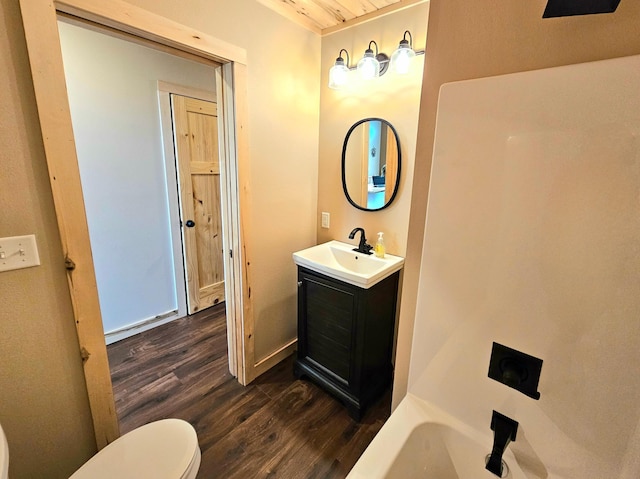 44811 County Highway 14, Perham, MN 56573 - bathroom with a tub to relax in, hardwood / wood-style floors, vanity, and toilet