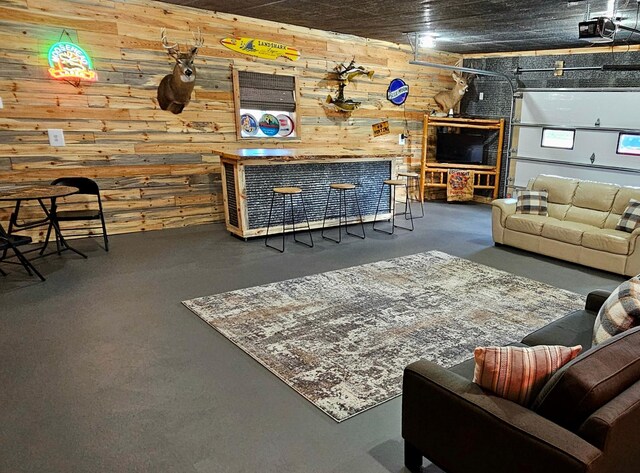 44811 County Highway 14, Perham, MN 56573 - living room featuring wood walls and concrete flooring